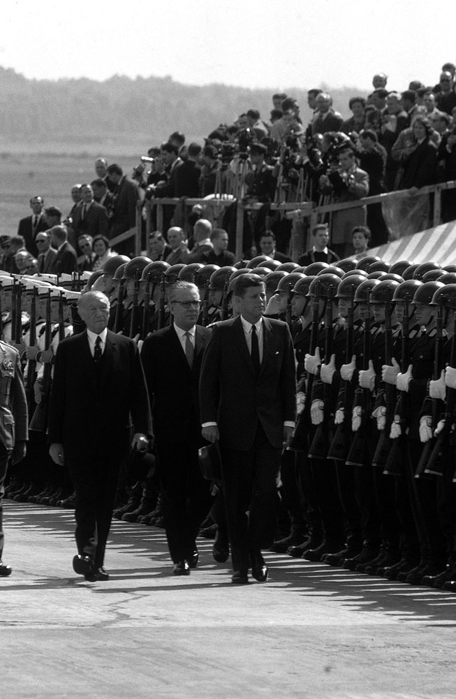 President John F. Kennedy (right) walks past German armed forces during his June 1963 visit to Germany.