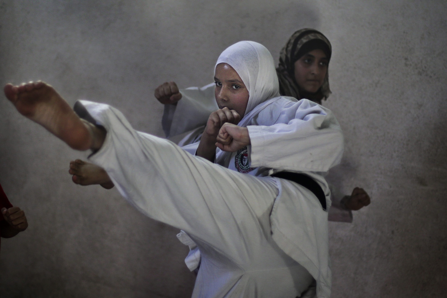Palestinian girls attend a Karate class