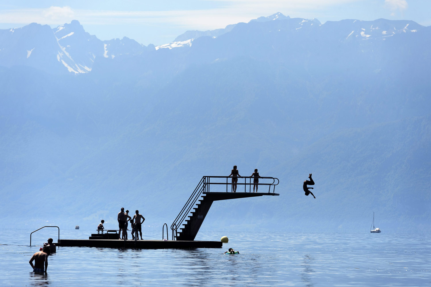 People go for a swim in Lake Geneva