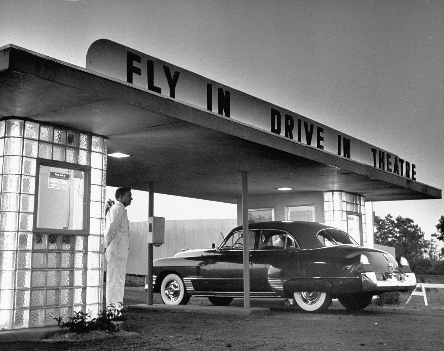 Customers arriving by car at a "fly-in drive-in" theater, New Jersey, 1949.