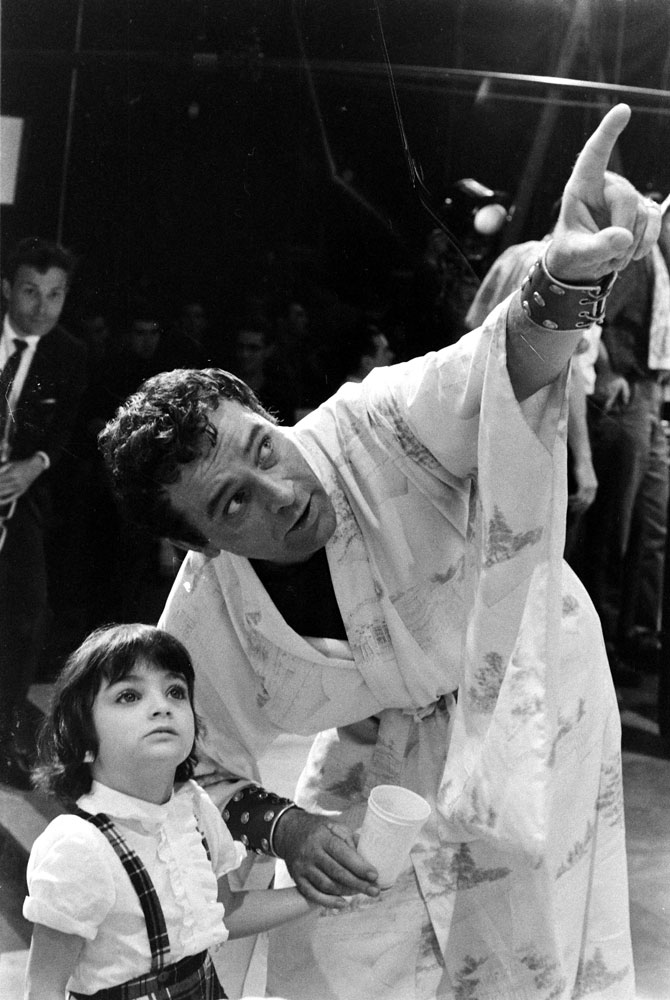 Richard Burton with Elizabeth Taylor's daughter, Liza, on the set of Cleopatra, Rome, 1962.