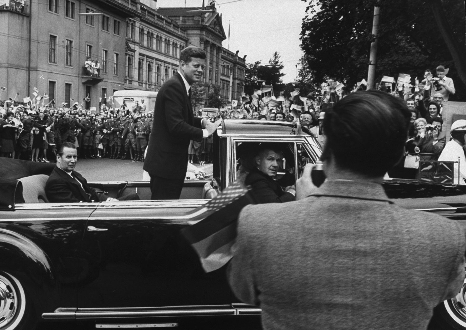 President John F. Kennedy in a motorcade during his trip to Germany, June 1963.