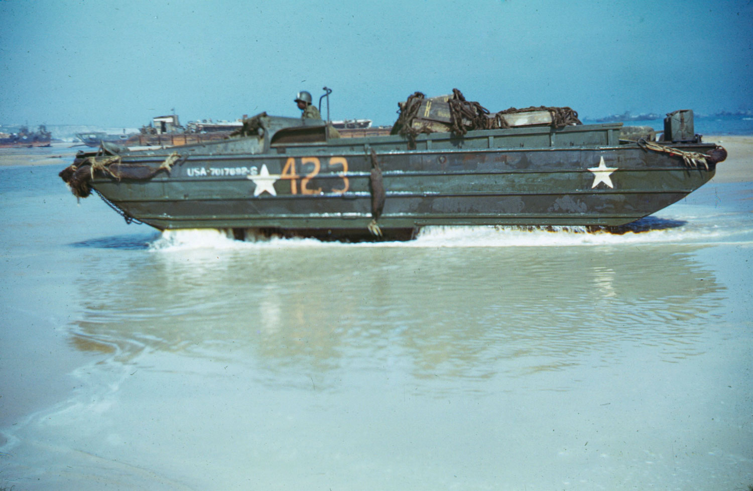 An amphibious "duck" comes ashore from its landing craft, Normandy, summer 1944.