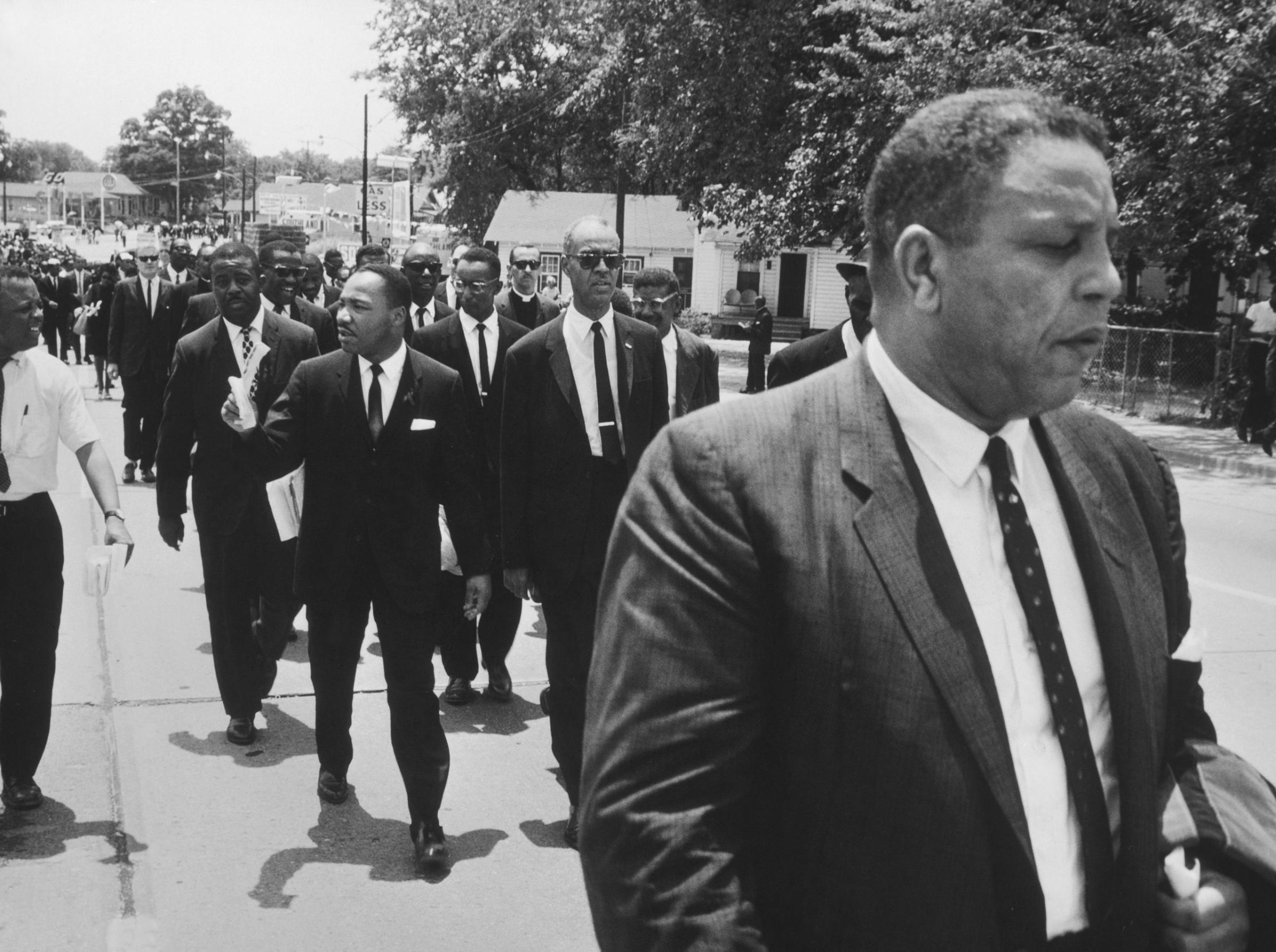 Martin Luther King, Jr., Ralph Abernathy and other civil rights leaders walk in Medgar Evers' funeral procession, Jackson, Miss., June 15, 1963.