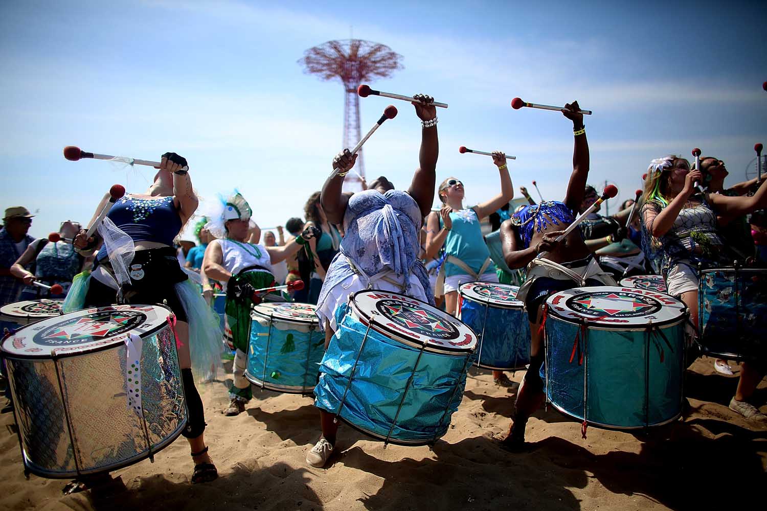 June 22, 2013. Musicians perform on the beach at the 2013 Mermaid Parade at Coney Island in the Brooklyn, NY.