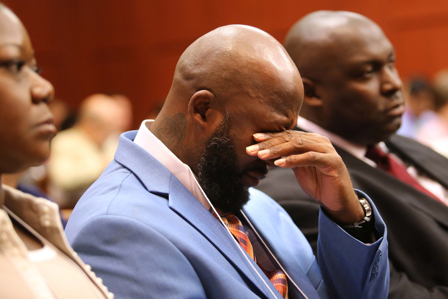 June 24, 2013. The father of  Trayvon Martin, Tracy Martin, cries as he listens to the description of his son's death, with Sybrina Fulton, Trayvon's mother, at left, and Daryl Parks, a family attorney, at right, during the 11th day of the George Zimmerman trial in Seminole circuit court in Sanford, Fla.