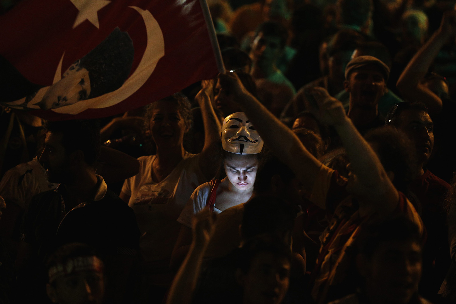 A protester uses her mobile phone during a demonstration at Taksim Square in Istanbul
