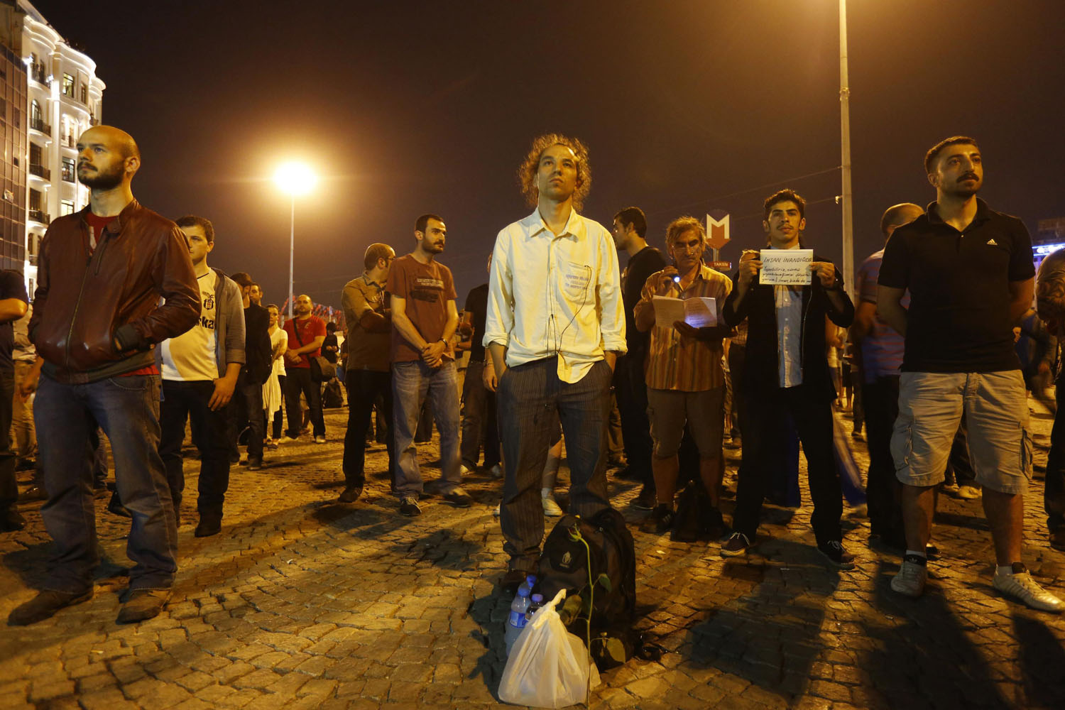 Gunduz stands in a silent protest at Taksim Square in Istanbul