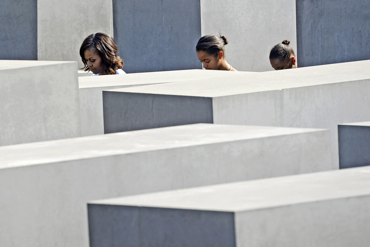 U.S. first lady Michelle Obama and her daughters Malia and Sasha visit the Holocaust Memorial in Berlin