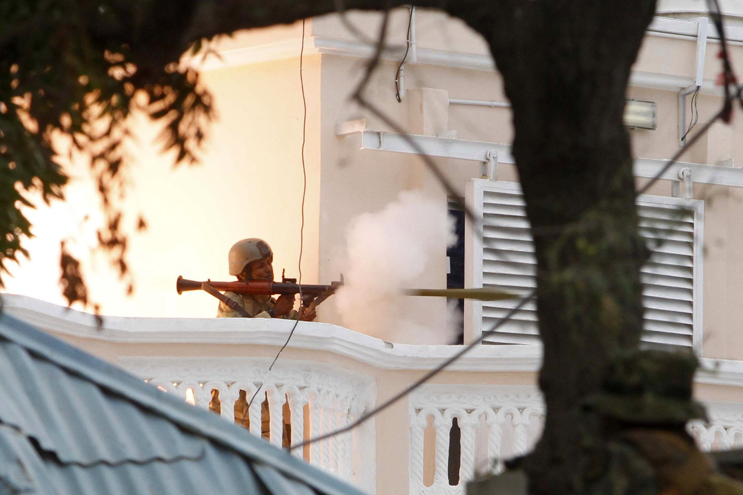 Soldier fires a RPG after gunmen attacked the United Nations compound in the Somali capital Mogadishu