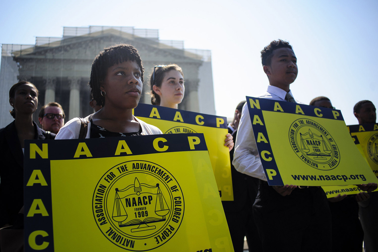 June 25, 2013. Jessica Pickens, 19, of Chicago, Il. stands with fellow voting rights activists outside the U.S. Supreme Court in Washingto, DC the day the court ruled on the Voting Rights Act striking down portions of the law.