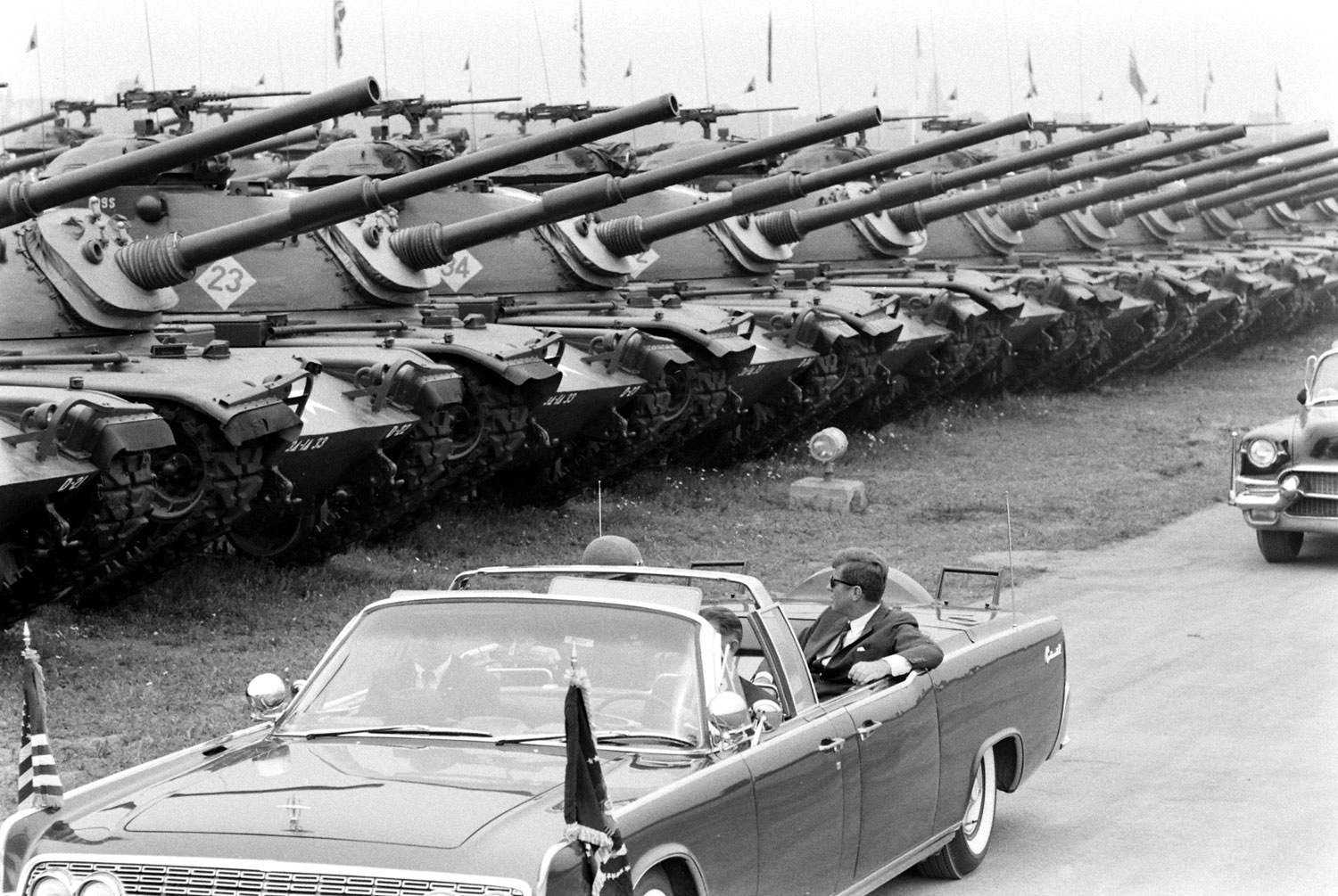 President John F. Kennedy, in open limo, reviews the U.S. Army's 3rd Armored Division ("Spearhead"), West Germany, June 1963.