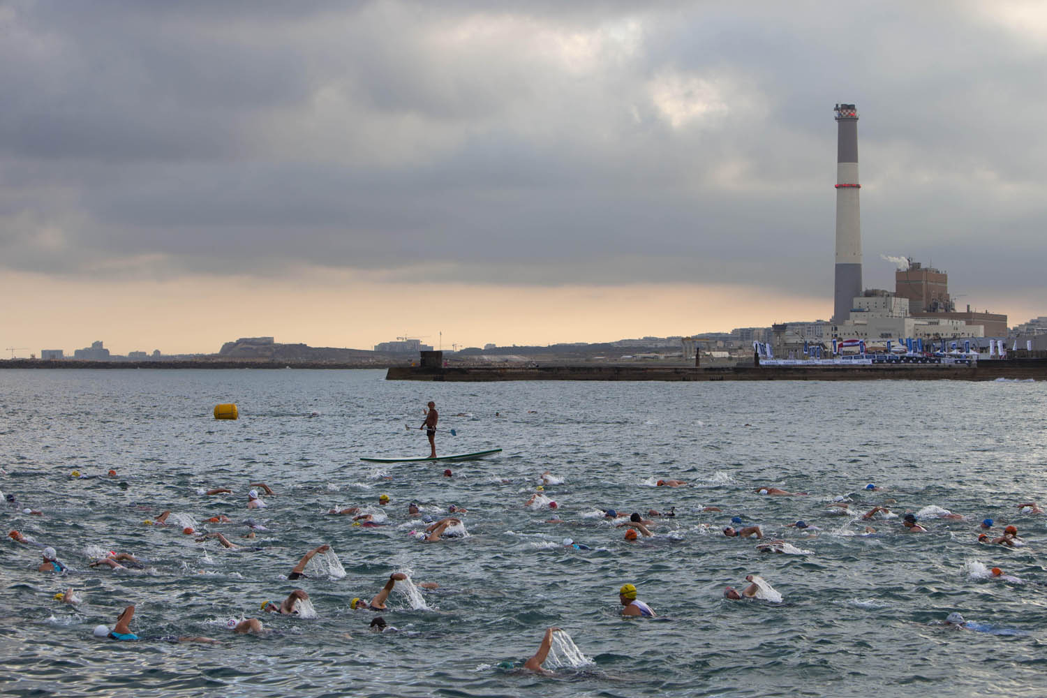 June 22, 2013. Athletes swim in the Mediterranean Sea at the beginning of the Tel Aviv Triathlon in Tel Aviv, Israel.