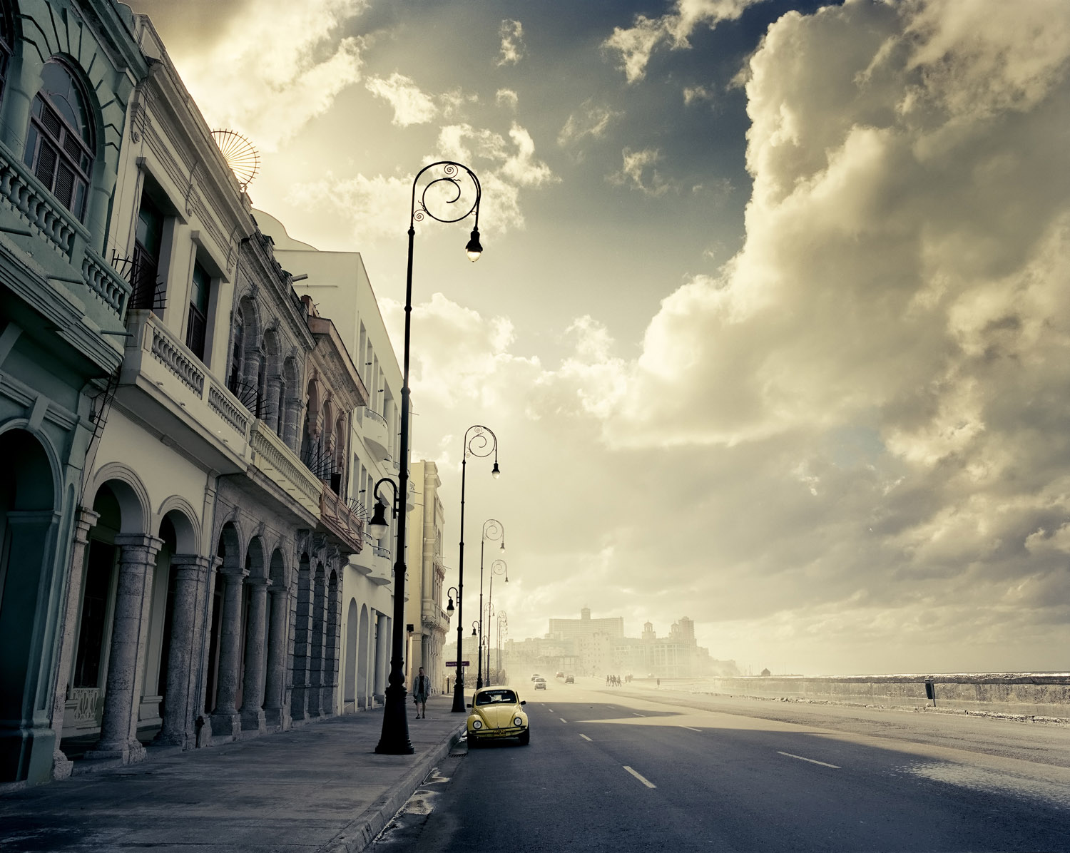 Havana’s most famous street, the Malecon at6 PM the day the cold front arrives and the sea gets choppy, and waves spray passing cars and pedestrians