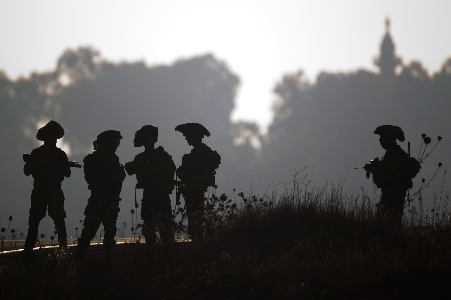 June 26, 2013. Israeli soldiers of the Golani brigade gather during training in the Israeli controlled Golan Heights near the border with Syria.