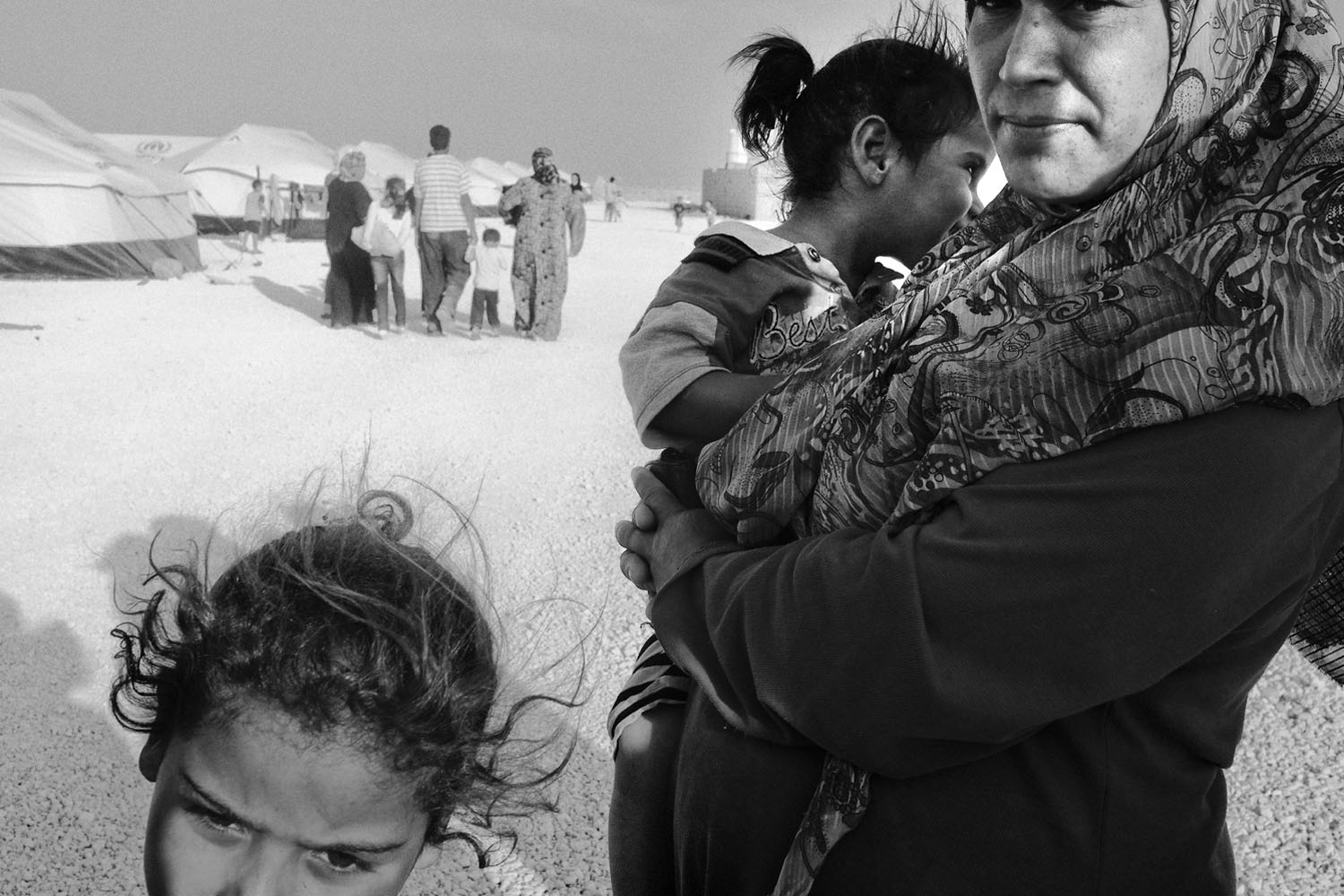 JORDAN. Zaatari, Refugee Camp. August 30, 2012. Syrian refugees, mostly women and children, at the Zaatari refugee camp near the Syrian border in Jordan. Contact email:New York : photography@magnumphotos.comParis : magnum@magnumphotos.frLondon : magnum@magnumphotos.co.ukTokyo : tokyo@magnumphotos.co.jpContact phones:New York : +1 212 929 6000Paris: + 33 1 53 42 50 00London: + 44 20 7490 1771Tokyo: + 81 3 3219 0771Image URL:http://www.magnumphotos.com/Archive/C.aspx?VP3=ViewBox_VPage&IID=2K7O3RKH34UF&CT=Image&IT=ZoomImage01_VForm