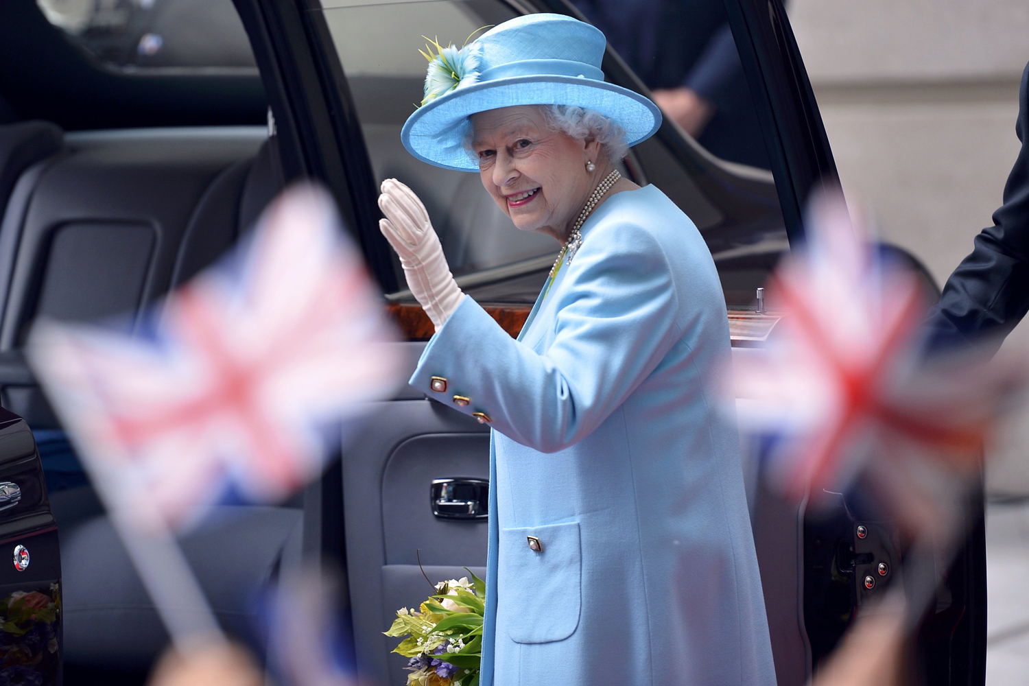 Britain's Queen Elizabeth waves after visiting BBC Broadcasting House in London