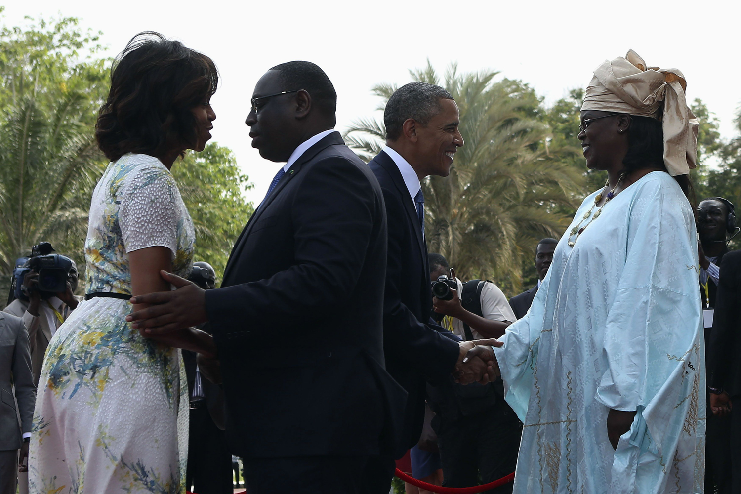 June 27, 2013. U.S. President Barack Obama and first lady Michelle Obama are greeted by Senegal President Macky Sall and his wife Mariame at the Presidential Palace in Dakar.