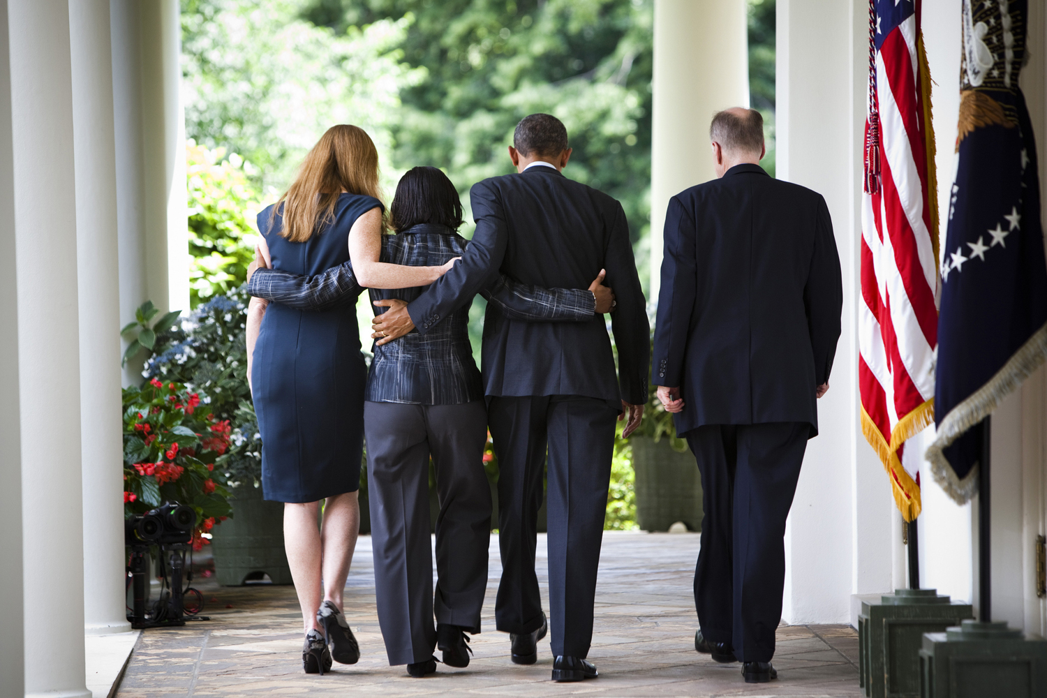 President Barack Obama with officials after an announcement in the Rose Garden of the White House.