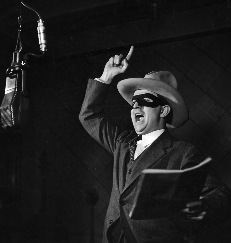 Actor Earle Graser plays the Lone Ranger on Detroit's WXYZ radio in 1937.