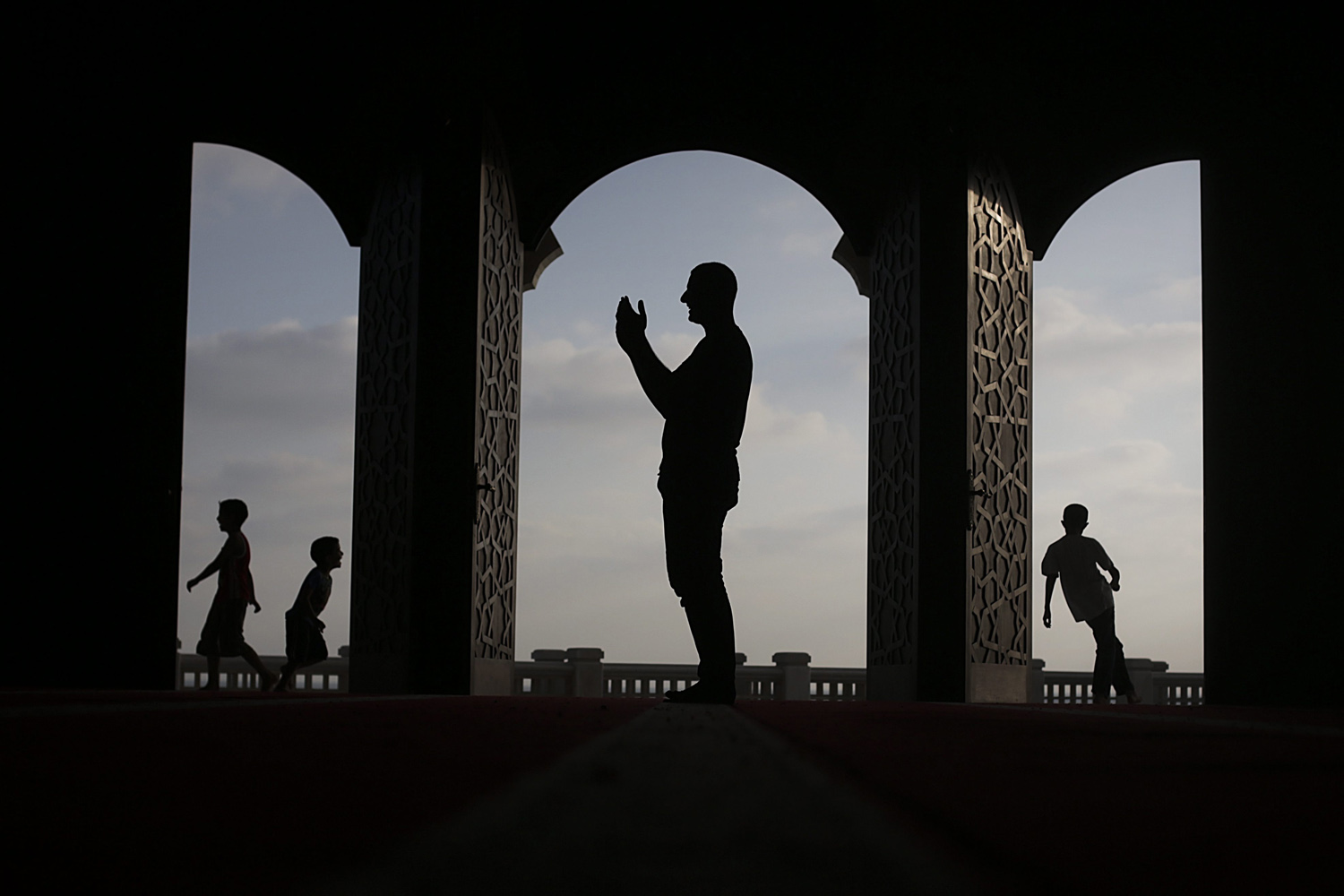 July 12, 2013. A Palestinian man prays in a mosque during the holy month of Ramadan in Gaza City, Gaza Strip.