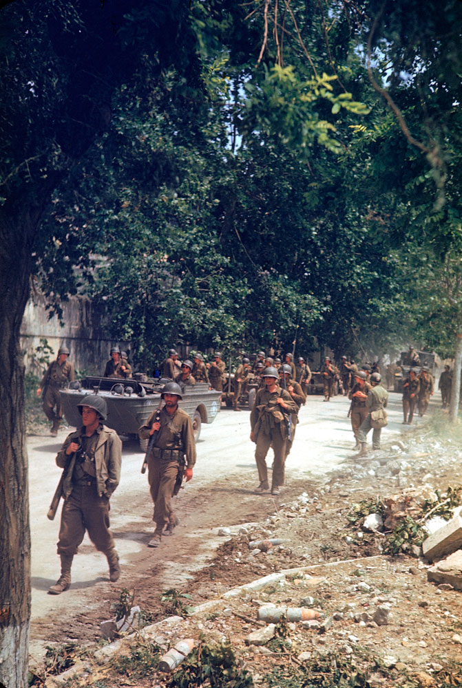 American soldiers march up the Appian Way during the drive towards Rome, WWII.