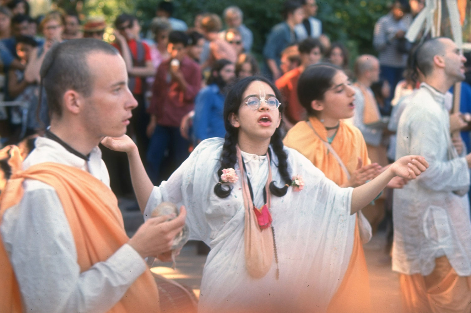 Hare Krishna devotees wear traditional saffron robes and chant in a New York park, summer 1969.