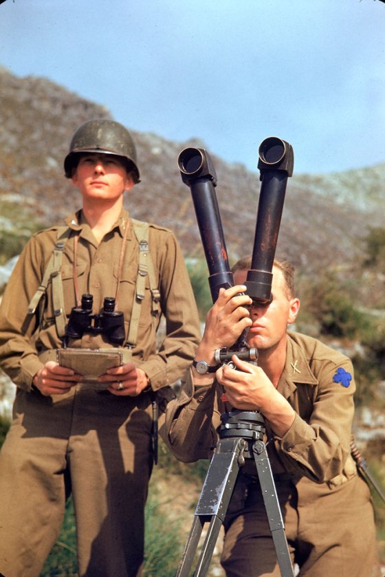 American soldier trying to spot German positions during the Allied drive towards Rome, 1944.