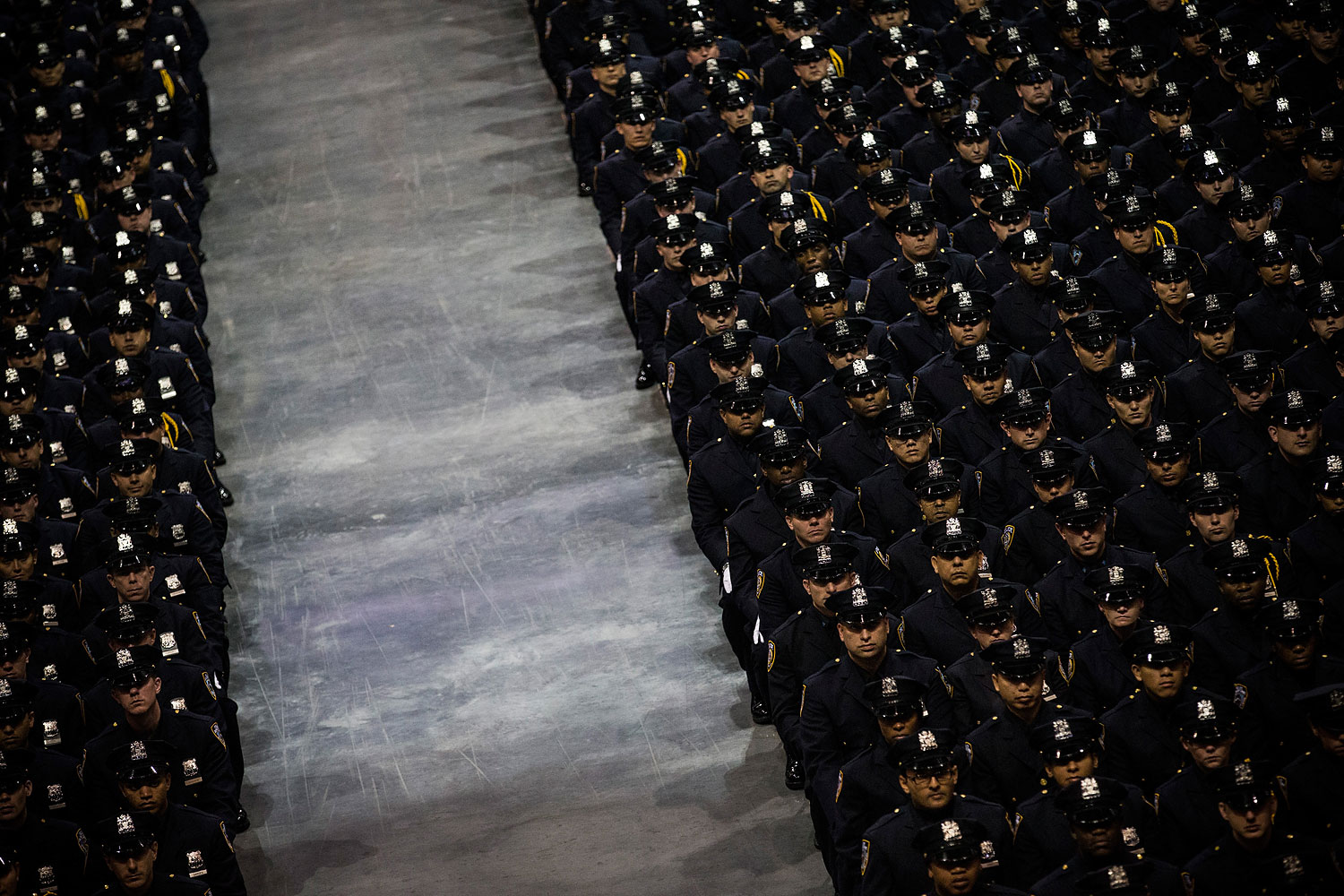 July 2, 2013. City Police Academy cadets attend their graduation ceremony at the Barclays Center in the Brooklyn borough of New York City.