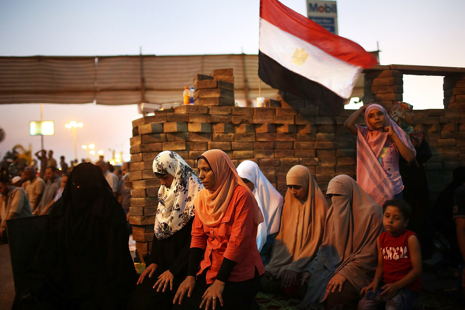 July 12, 2013. Female  supporters of ousted president Mohamed Morsi participate in the evening Friday prayer on the third day of Ramadan, the sacred holy month for Muslims where many will fast from sun-up to sun-down in Cairo, Egypt.