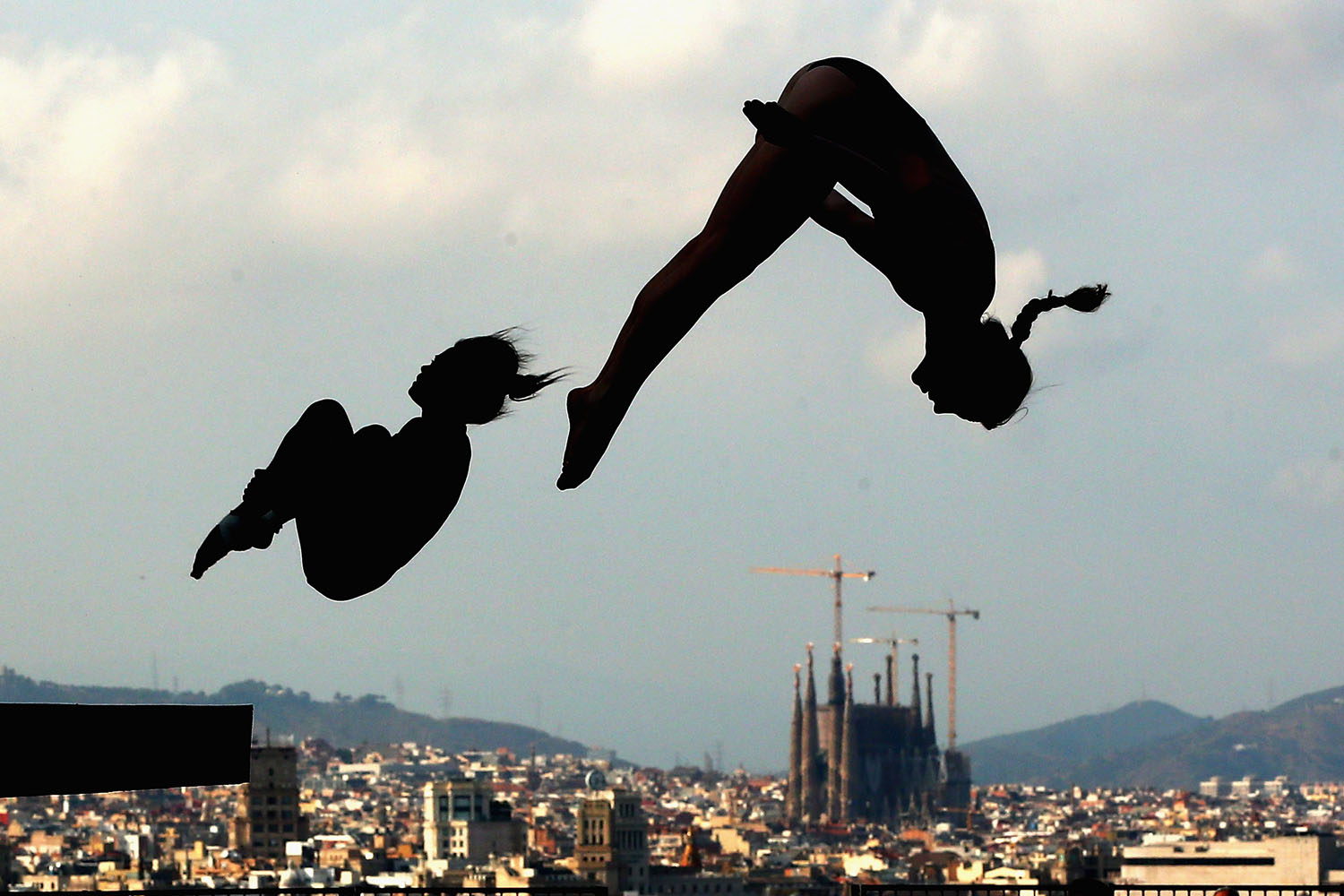 July 17, 2013. Diving competitors practice during a training session ahead of the FINA World Championships in Barcelona, Spain.