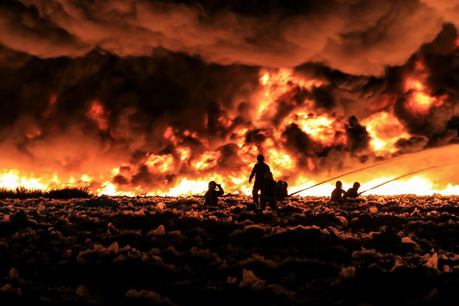 Fire fighters tackle a large blaze at a recycling center in Smethwick, near Birmingham, central England.