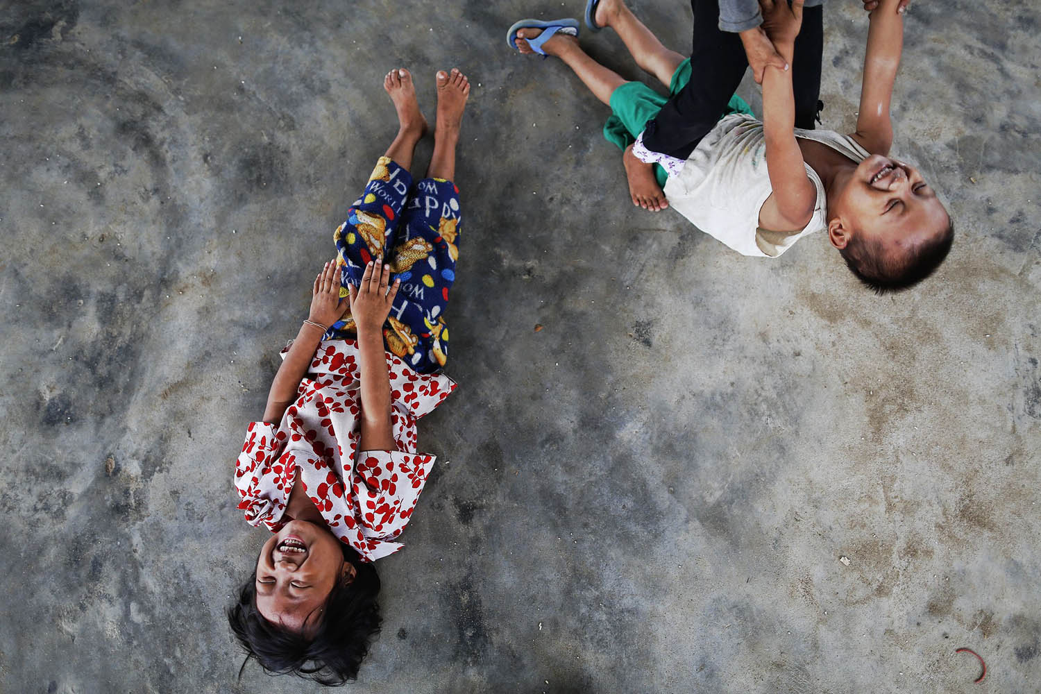 Children play at a camp for internally displaced persons in suburbs of Myitkyina