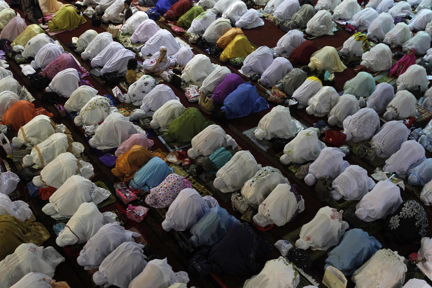 Muslim women attend an evening mass prayer session to mark Ramadan in Jakarta