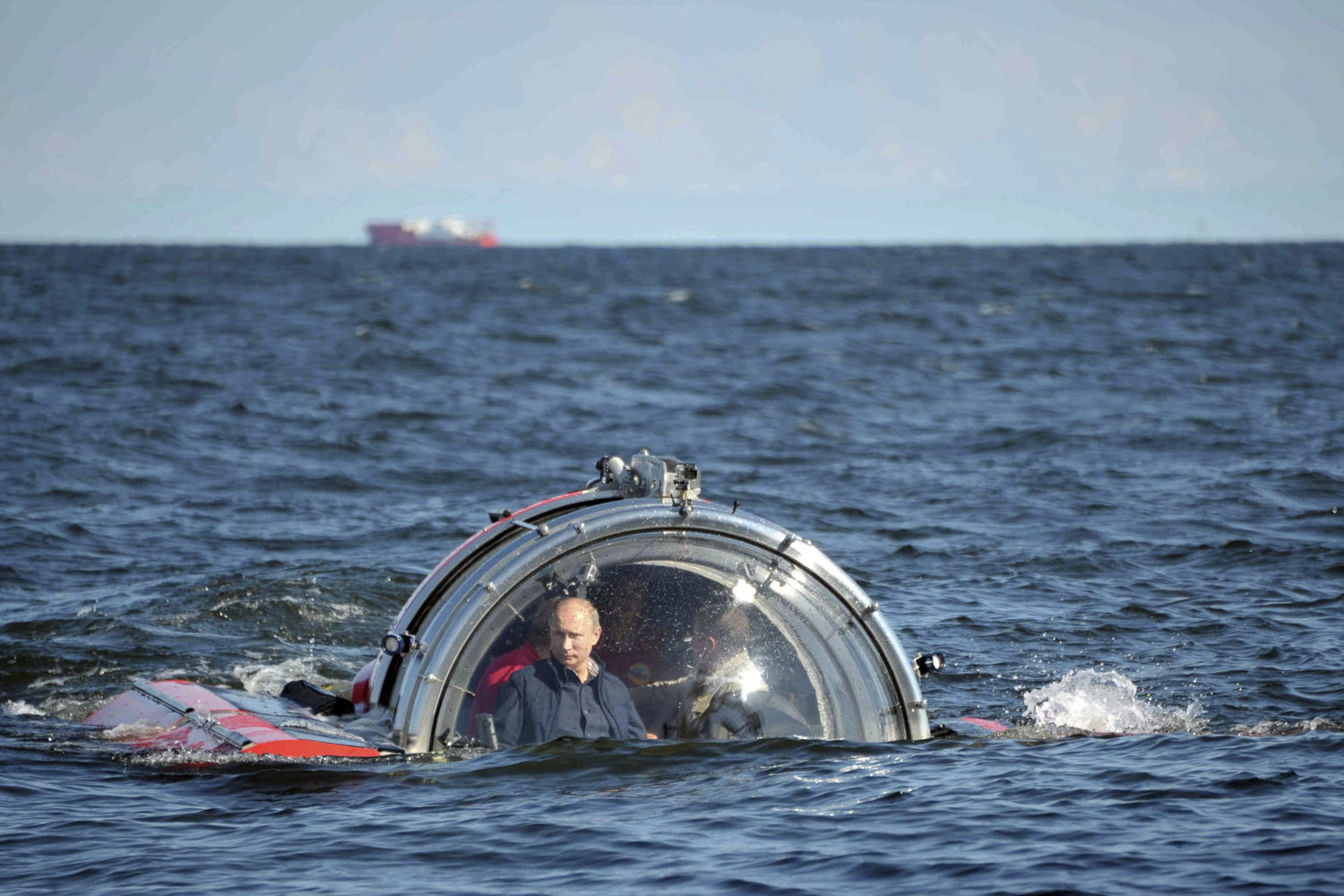 July 15, 2013. Russia's President Vladimir Putin (L) is seen through the glass of C-Explorer 5 submersible after a dive to see the remains of the naval frigate  Oleg , which sank in the 19th century, in the Gulf of Finland in the Baltic Sea.