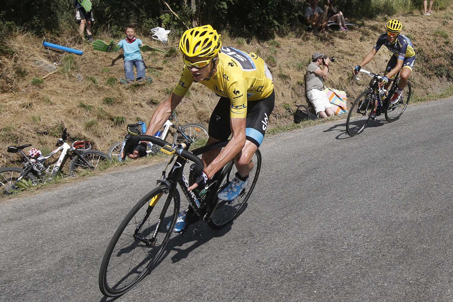 July 16, 2013. Christopher Froome of Britain, wearing the overall leader's yellow jersey, and Spain's Alberto Contador, right, speed down manse pass in the last kilometers of the sixteenth stage of the Tour de France cycling race over 105 miles with start in in Vaison-la-Romaine and finish in Gap, France.