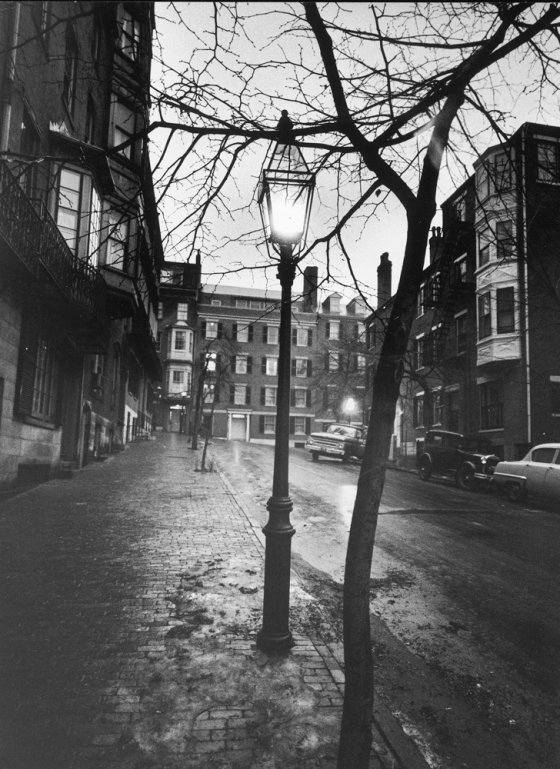A rainy Beacon Hill street at dusk during the era of the Boston stranglings, 1963.