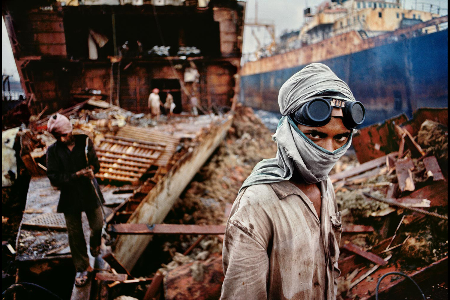 Welder in a ship-breaking yard, Bombay, India, 1994
                              
                              
                              ‘The ships are absolutely huge, and these people are like termites, slowly breaking them down. The vessels are reduced to scrap within three or four months, and then just gone.’