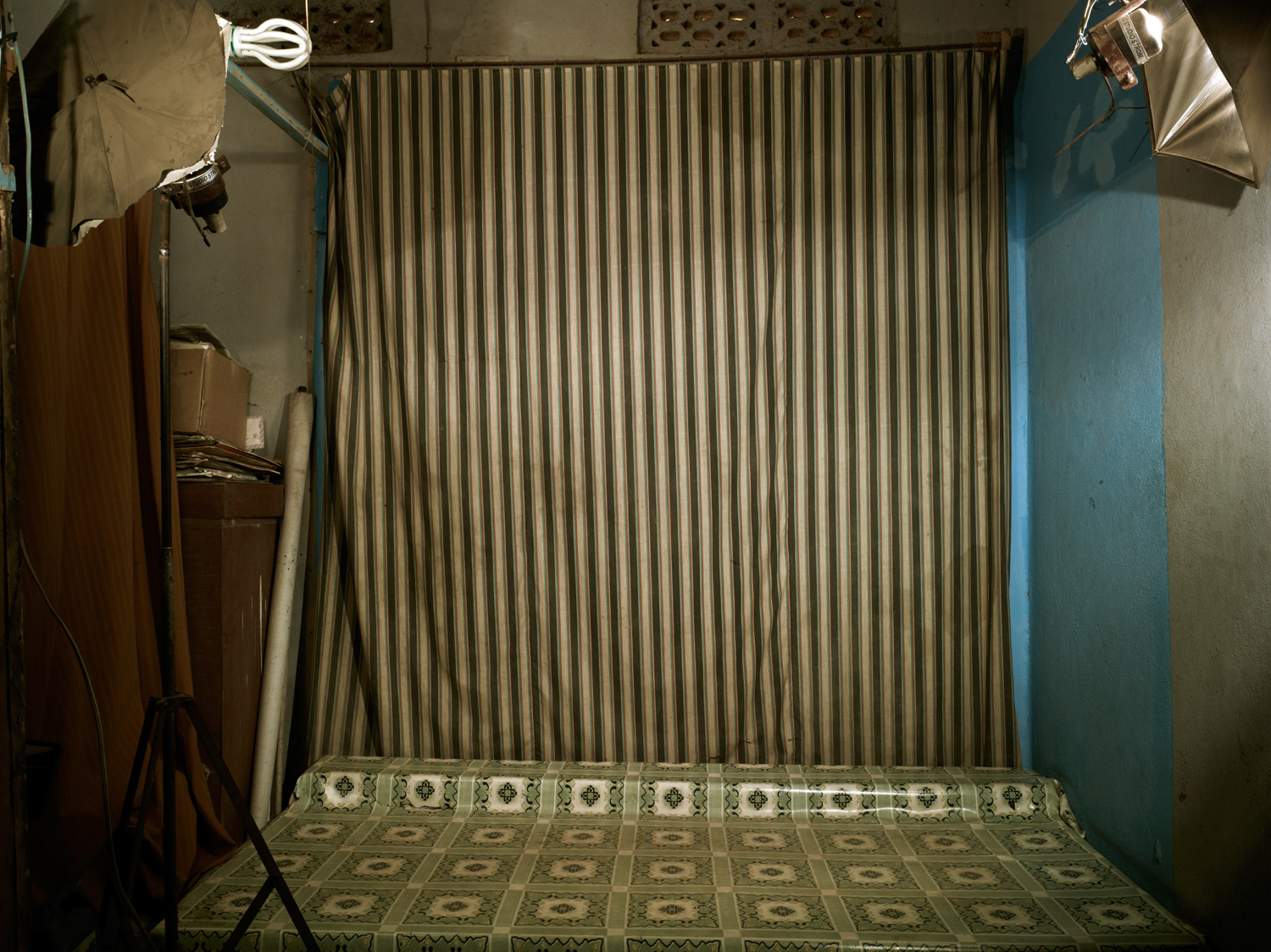 The following photographs were taken in Bamako, Mali in March 2013.
                              A curtain used as a backdrop hangs in Malick Sidibe's Bamako studio. The curtain has been in use since the opening of the studio in 1960 and never has been replaced. Many of Sidibe's most famous photographs feature the backdrop.