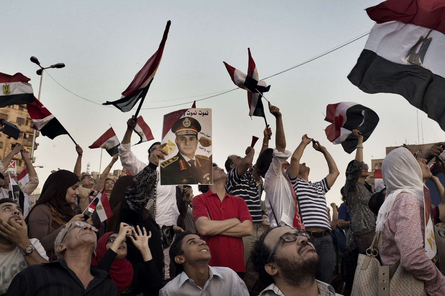 July 7, 2013. The military, which has sided with the anti-Morsi demonstrators, did its part to stoke patriotic passions. Each time military helicopters and jets flew above the square, demonstrators cheered. Some held up posters of army chief Gen. Abdel Fattah al-Sisi.