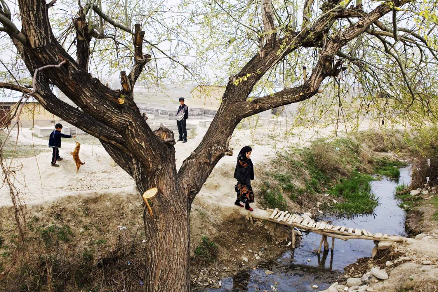 Villagers along a canal near the border between Uzbekistan and Kyrgyzstan.