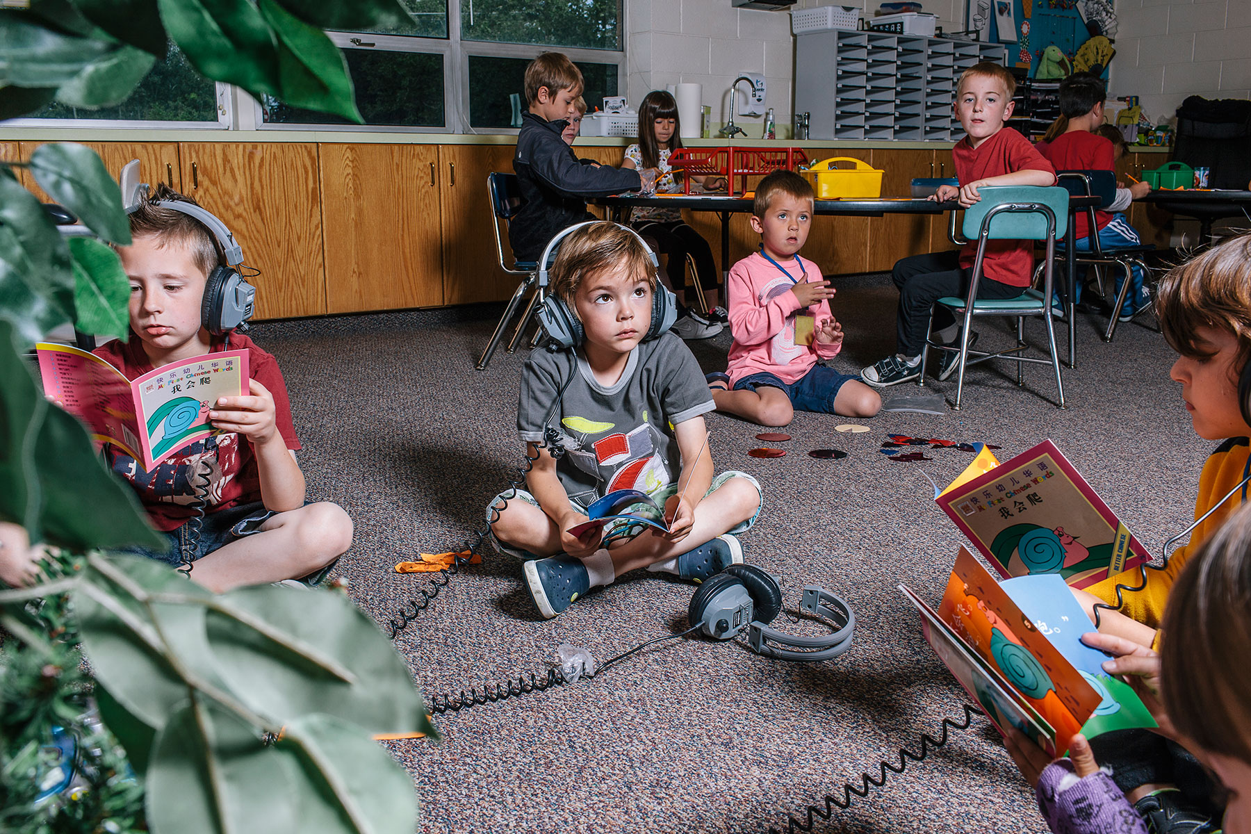 A group of Utah first-graders listen and read along in Mandarin (Michael Friberg for TIME)