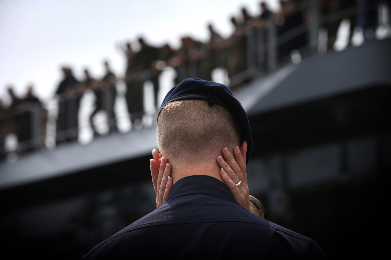 July 14, 2013. A member of the Zr. Ms. Johan de Witt Dutch navy warship says goodbye to a loved one on the quayside in Den Helder, Netherlands.