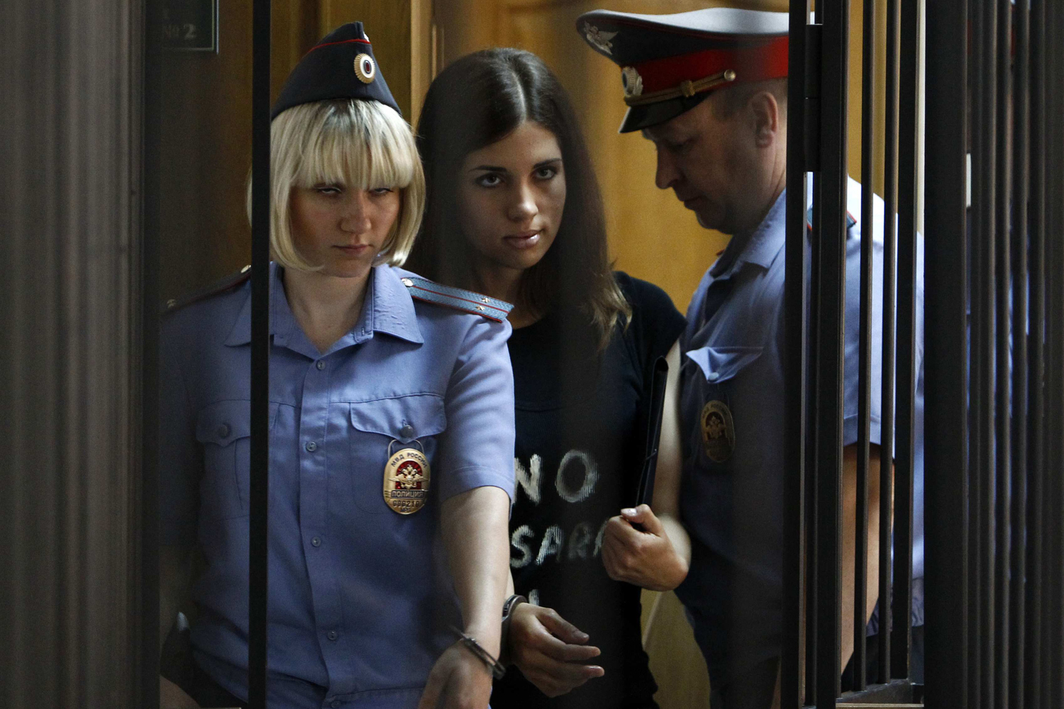 Member of the female punk band "Pussy Riot" Tolokonnikova is escorted before a court hearing to appeal for parole at the Supreme Court of Mordovia in Saransk