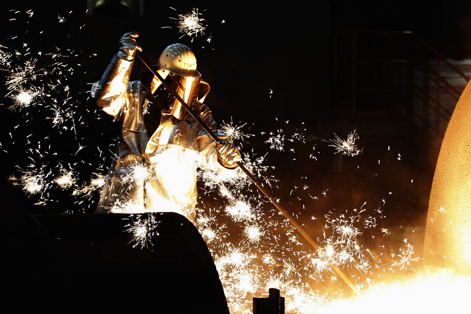 File photo of worker of German steelmaker ThyssenKrupp controlling a blast furnace in Duisburg