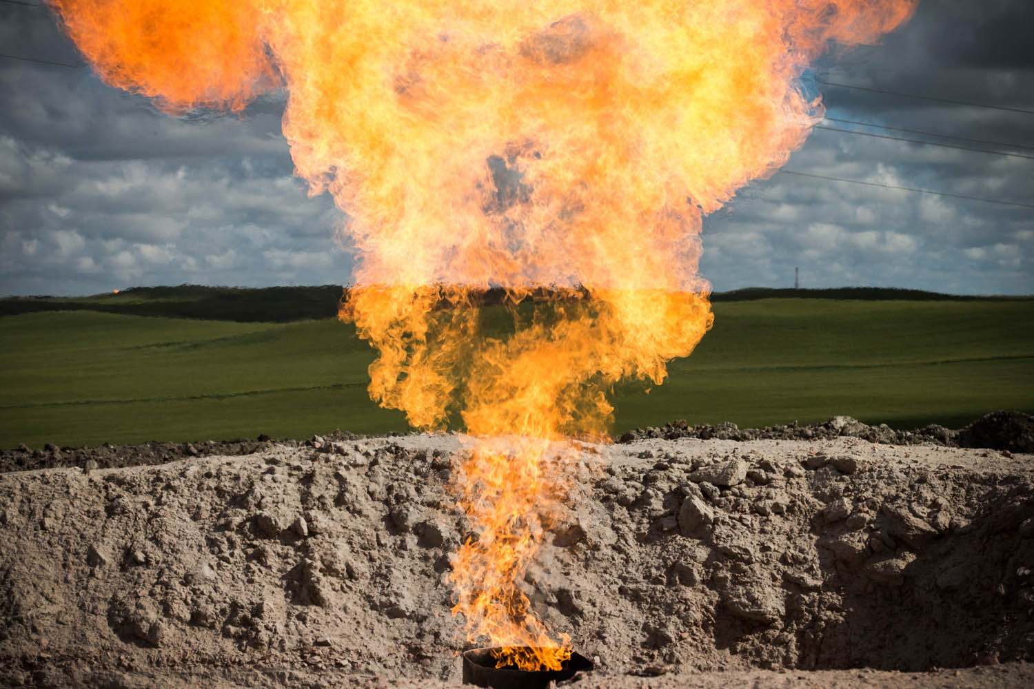 July 26, 2013. A gas flare is seen at an oil well site outside Williston, North Dakota.