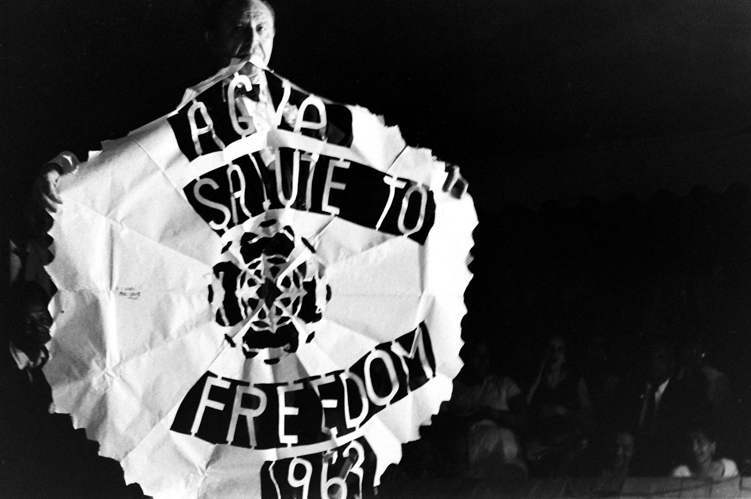 A man holds an American Guild of Variety Artists banner during the Salute to Freedom benefit concert in Birmingham, Ala., August 5, 1963.
