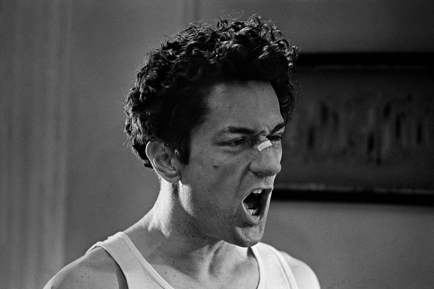 The following photographs were taken in New York in 1979.De Niro, as LaMotta, screams aggressively, accusing his brother of sleeping with his wife.