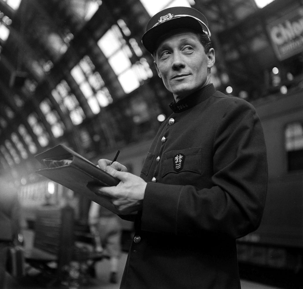Rail employee at a station along the route of the Simplon-Orient Express, 1950.