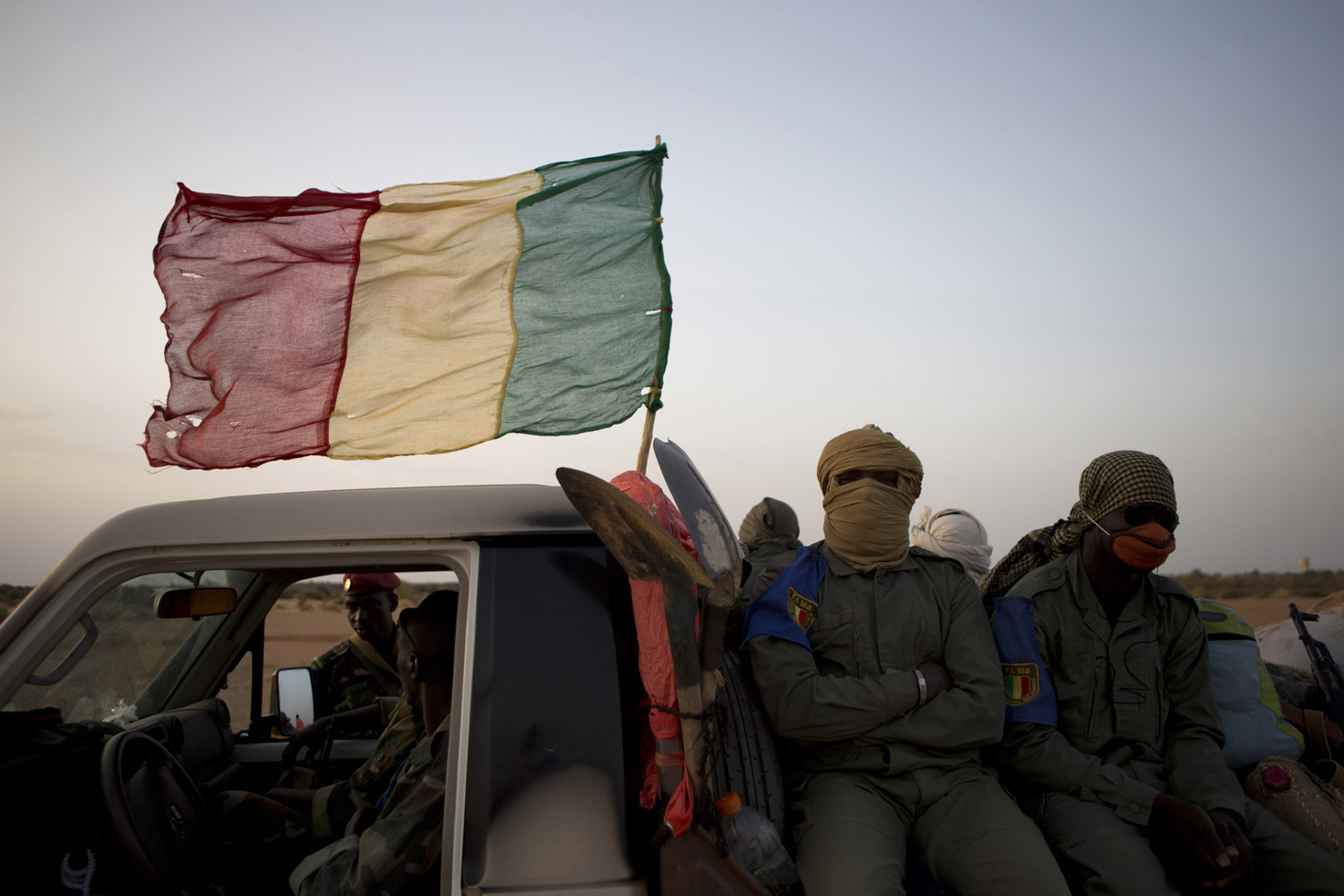 July 26, 2013. Malian army commandos ride in a convoy on a road outside Gao, Mali.